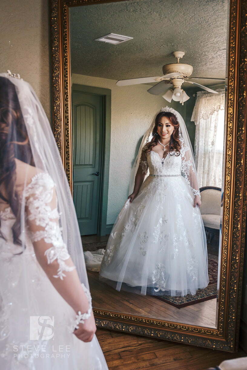 bride looking in mirror 